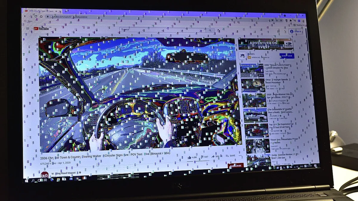 Glitched and garbled display on a workstation laptop with a defective graphics card that underwent extensive overheating from use in a hot environment