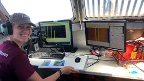 UNH summer intern aboard NOAAS Thomas Jefferson (S 222) in 2021 with computer monitors