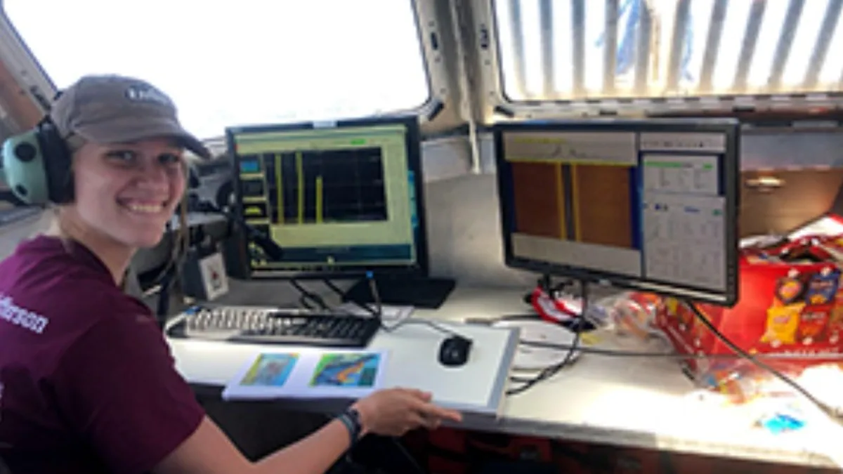 UNH summer intern aboard NOAAS Thomas Jefferson (S 222) in 2021 with computer monitors