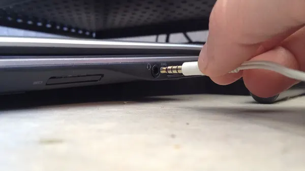 Plug microphone into laptop computer