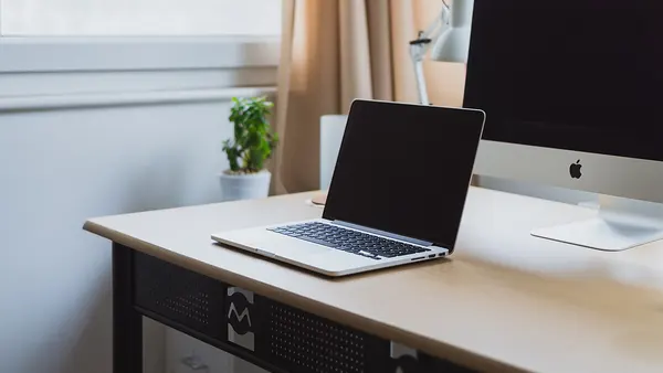Laptop on a neat desk (Unsplash)