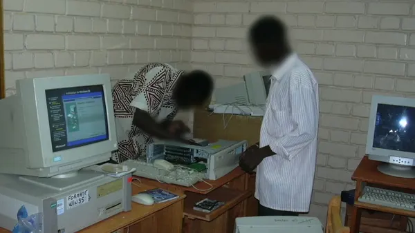 NTBF volunteers setting up a computer at CIJEF, Ouagadougou