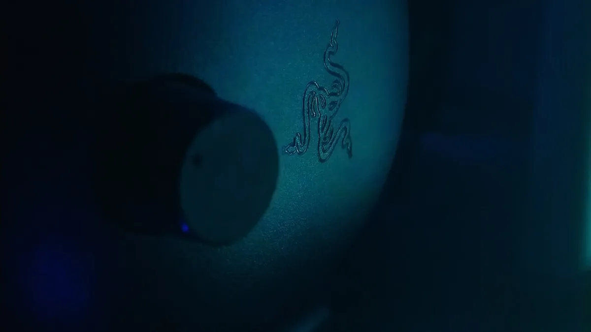 RGB gaming headset on desk with ambient lighting