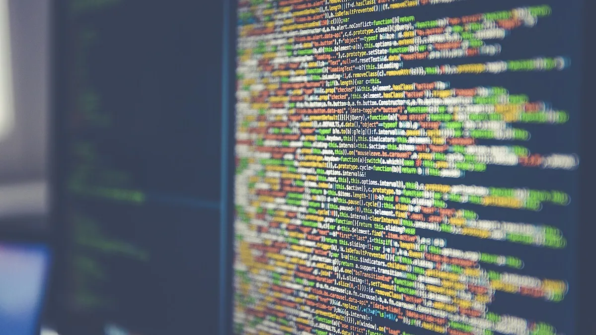 Code on computer monitor (Unsplash)