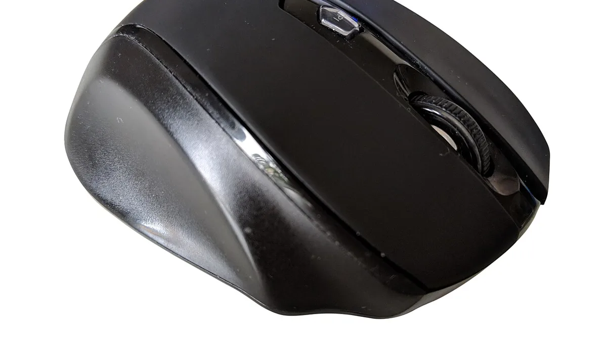 A black wireless computer mouse