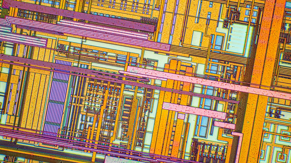 Silicon chip from a computer laser mouse under a microscope 50х