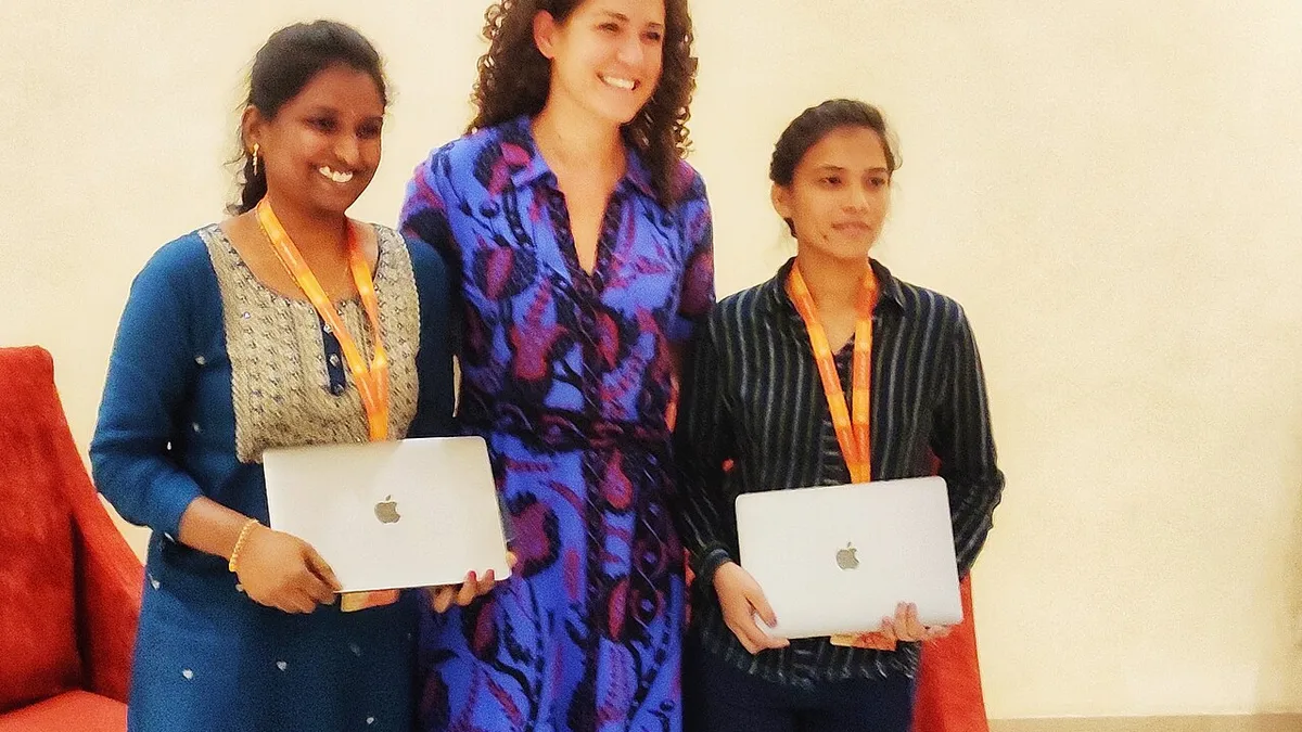 Tulspal and Divya of Wikipedia after receiving Apple laptop from Wikimedia foundation Iduring WWC 2023IMG 20231021 200242-01