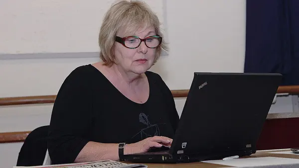 Woman with glasses using a ThinkPad laptop (67503269)