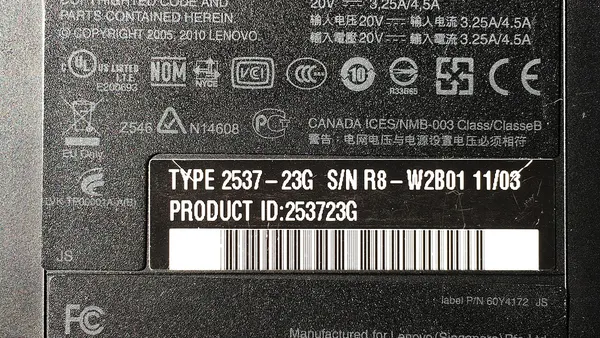 Type label on lower side of Lenovo ThinkPad T410 laptop from 2011