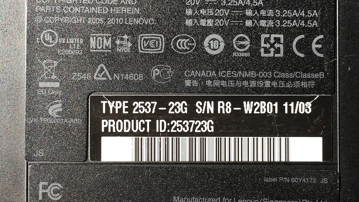 Type label on lower side of Lenovo ThinkPad T410 laptop from 2011