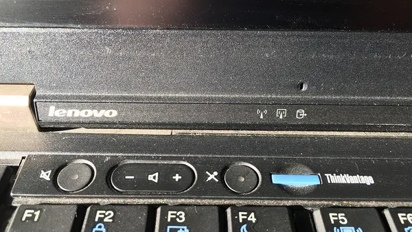 Upper left part of keyboard on Lenovo ThinkPad T410 laptop with function keys and sound controls