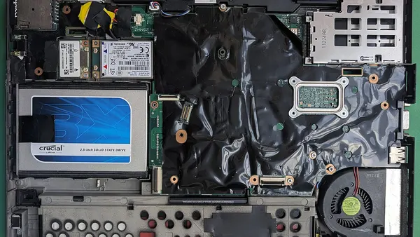 Disassembled Lenovo ThinkPad X220 motherboard without keyboard bezel